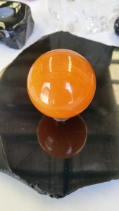 Orange calcite sphere at Heart of the Bay, Byron Bay.